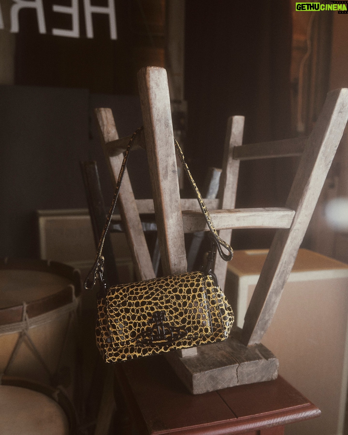 Vivienne Westwood Instagram - Our medium Hazel bag features this season's 'Sticky Croc' design, complete with an imaginary prehistoric reptile motif. The piece is finished with patent embossing, as a playful ode to 80's style.
#VWSS24