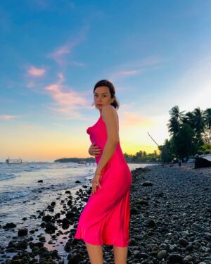 Beauty Gonzalez Instagram - I love a fabulous White Sand Beach as much as anyone ,
But there is something wildly romantic about this dark patch of Negros Coastline.🩶
Scattered with Eternal Rocks and Strewn with bleached driftwood from typhoons past, 
It is oftentimes Ominous and Foreboding, 
however at sunset it transforms, 
it gives an Ethereal Glow. 🧡
I feel like Catherine in WUTHERING HEIGHTS 💜