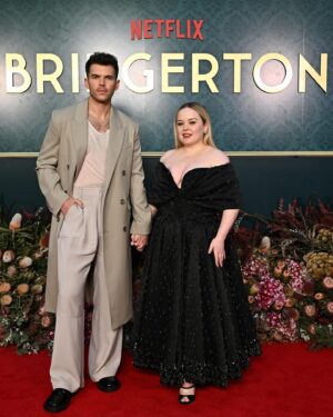 Nicola Coughlan Instagram - Surprise Oz! Lady Whistledownunder is in town 

So excited to kick off the Bridgerton World Tour in Australia! This moment has been literal years in the making I’m so excited we can finally start to share Season 3 with you all ❤️

A special thank you to THE Richard Quinn- I contacted him because I have been obsessed with this dress since I first saw it on the runway and dreamed of wearing it. I asked him if he and his brilliant team made it for me and they they did and it’s better than I ever could’ve imagined 🖤

Styled by @aimeecroysdill wearing custom @richardquinn & @malonesouliers 
Makeup @danielmartin 
Hair @gavinanesburybeauty 
@vrwpublicity 

#bridgerton #bridgertoninbowral
