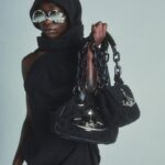 Vivienne Westwood Instagram - Find new and renewed silhouettes across luxury garments and accessories. Styles feature our archive Chain handbag, revisited with bondage-inspired hoops and a towelling fabric, or our Romper Bag trainers, offered in a black colourway this season.⁠
⁠
Now available online and across our boutiques. ⁠
⁠
#VWSS24