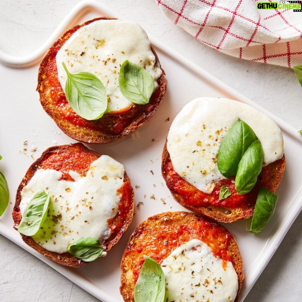 Martha Stewart Instagram - Why should bagels get to have all the fun? Each toasted English muffin is topped with marinara sauce and melty cheese before being garnished with a pinch of dried oregano and a few leaves of fresh basil. Play around with the flavors to create the pizza snack of your dreams. Get the recipe for these nostalgic treats at the link in our bio. 📷: @jason_donnelly_photography