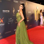 Lamitta Frangieh Instagram - When it’s time to glam 💫

Beauty by @lasirenegroup 
Dress @gio_dress 
📸 @omarhawari1 
Red carpet @sherif_thomas_official 

.
.
.
#redcarpet #longdresses #ladyingreen #dubai