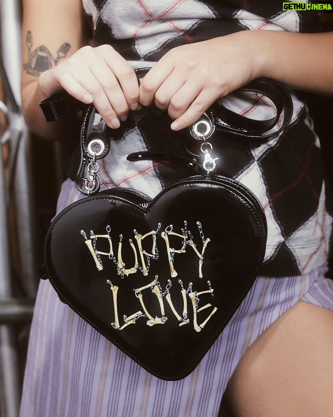 Vivienne Westwood Instagram - Find our Argyle jacquard across luxury garments this season, complete with a revisited checked motif. Style alongside our Heart Crossbody bag, featuring a bone motif, reminiscent of our Rock Chicken Bone T-shirt, from the archive 'Let It Rock' collection of 1971.
Now available online and across our boutiques.
#VWSS24
