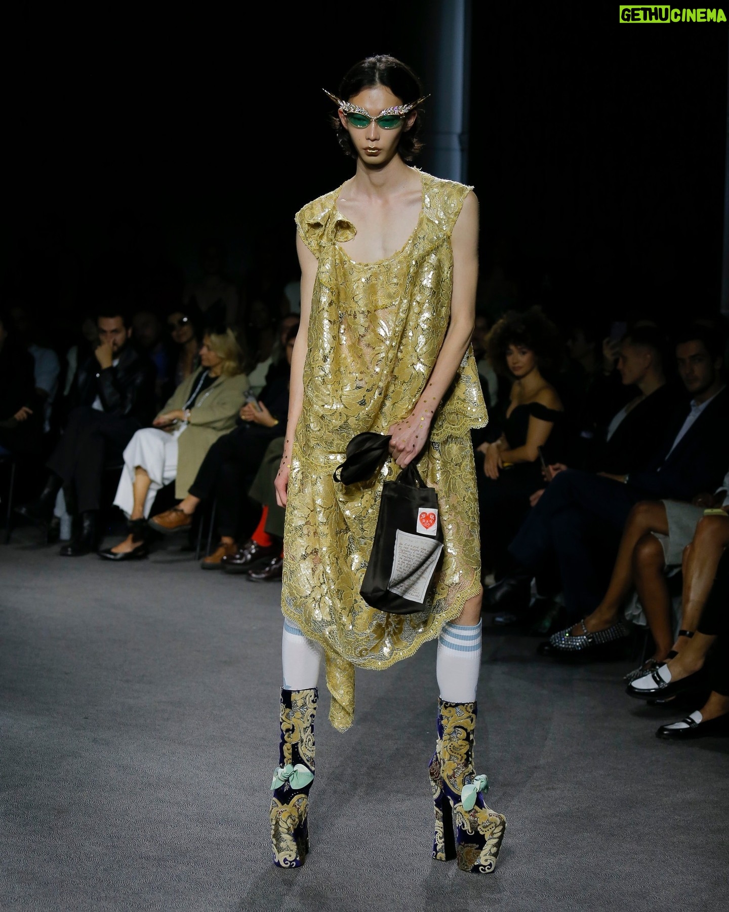 Vivienne Westwood Instagram - 'She had a very special relationship to time, she truly travelled in her mind' – Andreas on Vivienne.
Look #18 from the Andreas Kronthaler for Vivienne Westwood Spring-Summer 2024 collection, featuring elevated platforms, styled alongside a small show tote bag, and the Calypso Dress in sequin cotton lace.
#AKVWSS24