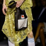 Vivienne Westwood Instagram – ‘She had a very special relationship to time, she truly travelled in her mind’ – Andreas on Vivienne.⁠
⁠
Look #18 from the Andreas Kronthaler for Vivienne Westwood Spring-Summer 2024 collection, featuring elevated platforms, styled alongside a small show tote bag, and the Calypso Dress in sequin cotton lace.⁠
⁠
#AKVWSS24