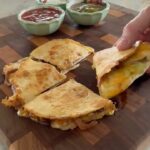 Ree Drummond Instagram - Sunday quesadillas.❤️ His (cheese & chicken) and mine (cheese, chicken, caramelized onions, Cholula, spicy avocado crema). My pregnancy craving from 20 years ago never went away. Whose quesadillas would you choose? (Say mine…)