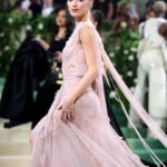 Phoebe Dynevor Instagram - What an absolute honour to attend The Met wearing custom @victoriabeckham. It was a DREAM to watch her and her incredible team create this dress in time for this epic night 🌸 thank you @nicky_yates thank you @gertielowe @charlottetilbury @sofiatilbury @davidvoncannon