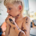 A.J. Cook Instagram - Leaving your youngest at home with daddy all day = fresh mullet✔️ neck tattoo✔️ and arm sleeve✔️ #bestdayever @nathanandy 🖤