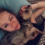 A.J. Cook Instagram - She just loves me so much....right??? Of course she’s not trying to suffocate me in my sleep. 🤔 #iwokeuplikethis #dogs
