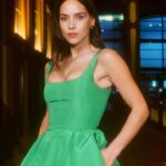 Adria Arjona Instagram - Green with envy. #AdriaArjona shows us how it’s done in a @CarolinaHerrera ensemble. Director & DP: @thestreetsensei Light & Color: @kchiucinematography Production: @ofbecomingus