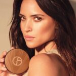 Adria Arjona Instagram - For an instant glow. Introducing the new sunlit LUMINOUS SILK BRONZING POWDER, which captures the feeling of basking in the summer sun through it's ultra-smooth texture and long-lasting wear to deliver an all-over Mediterranean glow. #Armanibeauty #LuminousSilk #AdriaArjona #Makeup #Bronzer #SummerMakeup