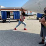Adrienne C. Moore Instagram - #BTS It's finally here. Happy season 2 premiere @prettyhardcases . So excited the US gets to binge it on @imdbtv, soon to be freevee. I've attached BTS photos from season 2. I have more to share, but I'll start here. 1. S/O to my girl @fieldhousekdp our glorious DP (cinematographer) of 2 seasons. She runs 3 departments on set and does it so well. I would often sit in her chair cause she would let me play with her cool camera gadgets while she was setting up shots. 2. To know me on set, is to know I'm always fooling around. Here I try to use all my might to push a private plane. Think I moved it at all? 3. Love my cast. Here's @b.darenherbert and my other fearless leader friend @meredithmacneill. 4. This was a night shoot til about 5am. We were trying to get as much in before the sun came up. 5. And this is a picture of the CN Tower on that night shoot that lasted til 5am. 6. Our award winning stunt director @southcampfilms. Yep, he's my friend. He's just an all around cool guy. 7. Me chasing somebody. You'll have to watch the episodes to see which episode this was. But facts, I'm always chasing somebody on this show. 8. Didn't know I had ups did you? 9. @jaydenmccrate my buddy and mic guy. He's like my little brother. He gets on my nerves but I love him. 10. And finally Ms @hairloks who braved hella high water and seas to come support me on this journey. Thanks Arlette. She got my back. Always!