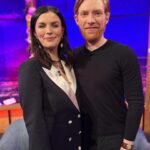 Aisling Bea Instagram – #aliceandjack EP 2 airs tonight on @channel4 but ALL 6 eps are NOW on All4❤️. So live your life how you see fit. 
These are recent bits of press pics I was too lazy/ without the spirit of the 20 year old I consider myself to be to do social media for. I tag all the things I wear because they are pretty much all from nice small companies, often female founded who are doing the lard’s work. And also people ask & this way is less admin for ole Beazer. 

1 – Myself & Domhnall looking like proud godparents at a christening on @latelaterte show last week (Working Girl power suit dress loaned from female tailor company who I LOVE @thedecklondon_ & earrings from London company @alighieri_jewellery which I got years ago & adore)

2 – With @thewhitmore & @patrickielty – we had much fun, thanks for having us on the show all Irish people get nervous about doing. 

3 @thismorning with my Queen @alisonhammond55 & cousin from Wexford @dermotoleary (wearing my @queensofarchive dress which is always a handy go-to.)

4 – A pale spread in between two tanned slices. The gal’s gals @joannemcnally & @voguewilliams having me as their prestigious 3rd ever guest on @mtgmstore podcast. Out now. 

5 – At the @bafta screening & q&a wearing Irish designer @robynlynchireland 

6 Another shout out to @thedecklondon_ for my pink suit for the @bafta @vanityfair party – yes I know my phone case is awful, but she’s mine & I never forget her in taxis. 

7 The gorgeous @michelle_kinsella_makeup & @bernadetteb_ from @hairpeople.salon doing a great job at grooming me, so to speak. Thanks also to @rowan.qms at @qmsmedicosmetics for making my face less of a mess & shining me up in time. 

8 My Mam and Aunt Bernie looking gorgeous & me wearing the hell out of my Donegal tweed @thelandskein – an Irish slow fashion brand founded by a lovely lady who makes things you buy to wear for a lifetime. 

9 @chooselove necklace by @racheljacksonjewellery with profits going to the charity. 

10 With the lovely @gabbylogan @gareththomasofficial  @acuthbert14 @jj.chalmers on Sin Bin wearing old clothes which in no way matched the sport’s brief. 

#aislingrecommendsecoorsociallyconsciousbrandseverydayuntilxmas