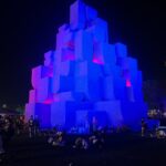 Aisling Bea Instagram - @coachella people! My amazing brother in law Madhav @nebbia.works has designed this huge, INCREDIBLE installation right opposite the mainstage. It’s called Babylon and from the outside is like a giant ancient monument, but INSIDE its huge structure, it has loads of amazing changing light installations. If you are there, go find it, head inside & dance/ hide from the desert sun/ find yourself/ take cute pics hunni and tag @nebbiaworks I would have gone but I am not biologically allowed in the desert. If you are not there, still have a look as it’s pretty, bloody special. Congrats Mads and Brando. #Repost from @coachella • Art rocks this year 🎨: Babylon by @nebbia.works 📸: @googlepixel_us #TeamPixel