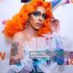 Aja Instagram - People are always talking about how they want this Aja to come back. But the truth is in this era of my life I was not being authentic to myself, and I kept formfitting myself to be something I wasn’t because I felt so unloved for being who I was I created this character that I knew to world with love, and it was, the true pinnacle of my artistry. Taking things that I saw people loved and styling it to myself. Now that I am fully realizing who I really am though. I know that it would be a different story. I look back and see the way that this turned into the infamous “burlesque rapper” era and I cringe, because I don’t think that that was some thing that I really wanted either. I think all I really wanted was to be seen as a woman and not a person who is performing the caricatures of a woman. But I was in such denial. I often feel that this era of my artistry ruined a lot of my career and pushed away thousands and maybe even hundreds of thousands of fans I’ve watched slowly over the past few years as I ago from almost hitting 1, million followers on Instagram to pinching back down and the constant commentary about “ didn’t she quit?” And such. My one confession today is that I really wish I would have had the resources to overcome my gender, dysphoria and privacy, and not made my struggles so public. I often wonder how differently it would affect my career today. Nonetheless, I am very proud of the woman I have become and I hope one day those hundreds of thousands of fans that I have lost can look back and learn to love me again. Because as it stands, I feel like compared to before it is much more a few people who are supporting my artistry at the moment, and it has led to a lot of me doubting the future of my artistry but with that I say, I will stay and stand strong. I know that I have not hit my peak yet as I get ready to load my next era, I said buckle up kids. This one is for you. 💛✨🩸