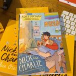 Alice Oseman Instagram - My novella NICK AND CHARLIE is out in the US/Canada in hardcover on Jan 3rd 2023 and I finally have a copy of it!!! I am actually obsessed with how this cover turned out. Perfect snuggly cosy Nick and Charlie vibes!!! ☀️🌙 You can preorder now from most book retailers!