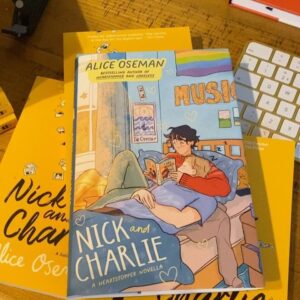 Alice Oseman Instagram - My novella NICK AND CHARLIE is out in the US/Canada in hardcover on Jan 3rd 2023 and I finally have a copy of it!!! I am actually obsessed with how this cover turned out. Perfect snuggly cosy Nick and Charlie vibes!!! ☀️🌙 
You can preorder now from most book retailers!