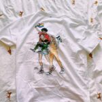 Alice Oseman Instagram - Happy Pride Month!!!! I’ve teamed up with @ecokaila to make a limited number of Pride t-shirts featuring the three leads of my YA novel LOVELESS (I miss them very much 💜)!! All profits are going to @notaphaseorg, which is a trans-led grassroots charity dedicated to campaigning, social projects, and funding new initiatives for the trans community. Eco Kaila are committed to sustainable and ethical clothing which is why I wanted to work with them!! You can get a shirt by going to ecokaila.com/aliceoseman Thank you for helping to raise money for an amazing cause this Pride month!! 🌈