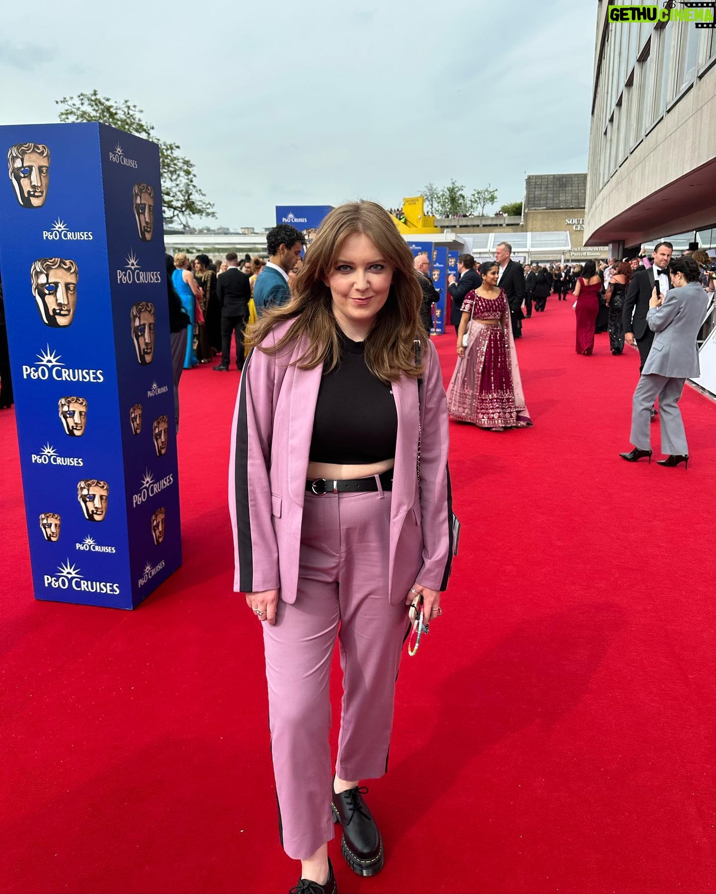 Alice Oseman Instagram - We may not have triumphed over Paddington and the queen… but we still had a fun time at the BAFTAs 🥹 Huge thanks to @andrianimakeup and @chadmaxwellhair for the makeup and hair!! And thanks to @wearewildfang for sending me this excellent suit 🩷