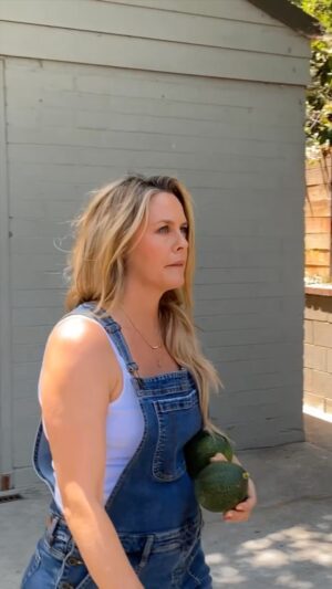 Alicia Silverstone Instagram - Avocado hunting... in my backyard! 🥑☀️ One of my favorite activities! I just need to find them before the squirrels do! 😂