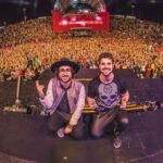 Alok Instagram - Muita coisa aconteceu pra essa música sair… A lot happened for this song to be released… 1. Tocando a Nossos Dias em Brasília no show da Nave Aurea / Performing the song together in Brasília at the Aurea stage. 2. ⁠Entrevista pós-The Town / Interview after The Town festival. 3. ⁠Alguns dos shows mais legais que fizemos juntos recentemente nas raras vezes que tocamos a Nossos Dias / A few of the most cool and recent shows we’ve been together and rarely performing the song. 4. ⁠A história por trás da música / The story behind the track. 5 6. ⁠Fotos de 2017 no começo da carreira juntos / Photos from 2017 when we were starting to performe together. 7. ⁠Nossos Dias agora disponível em todas as plataformas / Our new song “Nossos Dias” is out now!