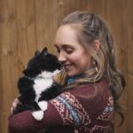 Amber Marshall Instagram - I recently passed the 1 Million followers mark on Instagram and it got me thinking about the content I’ve posted over the past 11 years… I have never been big on “selfies,” or photos of what I’m up to, but I do love sharing my farm, and the animal friends that adopt this space with us. The very first post I made on this account back in December 2012 was of our cat “Turner Valley” curled up on my bed. 📸 I had Shawn take this photo of me with her today to give an honourable mention to this sweet old kitty. “Turner Valley” was a stray I brought home in June of 2010. Heartland was filming in the town of Turner Valley and there was a litter of kittens born in an old storage shed in town. After confirming with the owners of the property that the cats were in fact strays… I set out on a mission that day to give one a good home. *For anyone out there who’s tried to catch eight-week-old untouched, stray kittens, it can be quite the challenge!! They are feisty little things and put up a good fight. After obtaining some thick leather gloves from our costume department I set out with a towel and was able to grab this little black and white hissing ball of fluff. I named her after the town she was born in, and took her home to begin gaining her trust. Turner has never been a cuddly cat, and prefers the company of dogs to humans or other cats, but for 14 years she has had a warm bed to sleep in and a full tummy. Her best friend was our old shepherd, Remi (yes from Heartland) who we brought home the same summer. They bonded instantly and Turner would always be the first to run to Remi and greet her, rubbing all over her and purring loudly. As soon as Remi found a good place to take a nap, Turner was there cuddled beside her. (Story too long for this post and continued in comments) Thanks for reading this #MarshallSundayStory! Any requests for next weeks Animal Story? 😊 To see more photos and posts of Miss Turner Valley scroll through or click here: #AmbersCatTurner