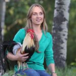Amber Marshall Instagram – This week I decided to go with my main man of the chicken coop for my #MarshallSundayStory please put your hands together for, Phoenix the rooster. 

Phoenix is not just any ordinary rooster. Not only has he travelled across the country to star in a commercial, but he also has spent far more time living inside our home than your average farmyard bird. Phoenix was one of many chicks that I purchased in the spring of 2019. Being smaller in size, he was instantly targeted by the flock and picked on. One day, I went out to find him badly beaten by the other members of the coop. I scooped him up and decided that he needed to come spend some time in the house recovering. He became so comfortable in the house and friendly with us, he stayed far past his welcome. Over the next couple years Shawn and I moved and started building at our new property. We didn’t have a barn or a chicken coop so again, Phoenix (who at the time was the only bird we had) made himself at home, living in our little cabin. He would wander around the yard during the day, and in the nice summer months would sleep on our front porch. 

When winter came I set up an area for him in the cabin… but for those who have been around roosters, know that their early morning crowing can be deafening. We soon put a stop to this as our cabin is only one room and it echoed quite loudly each morning. 

By this time our barn was nearly finished anyway so I moved him to his own spot out there and purchased 4 Americana (a breed of laying hen) chicks to keep him company. 

Phoenix has been around for five years now and is definitely the king of his castle now. His 4 ladies are still doing well and we have since built them a coop of their own. This rooster has been more than just a bird to us and I thank him for being such a special member of our family. 

#AmbersRoosterPhoenix To view more Animal Stories click #MarshallSundayStory