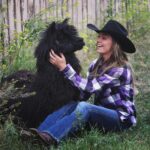 Amber Marshall Instagram – #MarshallSundayStory: Last week I told you the story of how my cat Turner came to live with me. This week, (after many requests) we will learn more about #BettyTheAlpaca who lived with us for a decade before she crossed the rainbow bridge. 

It was the summer of 2013 and I was at a ranch with my friend @KatieConnolley looking at some horses that were for sale. There was a lone alpaca there, so asked what her story was. The owner said he didn’t know how old she was, or much about her, as she had been left behind from a previous herd. He then said, “If you want her she’s yours.” 

I had no experience with llamas or alpacas but something about her just made me want to bring her home. She was not tame, and we had to wrangle her into a small pen, then rope and tackle her. I put an old t-shirt over her face to keep her calm, then we lifted her into the backseat of my truck – we hadn’t brought a trailer, so I sat holding her while my friend Katie drove us home (see last photo that was taken when we arrived home). 

I decided to turn her out with my cows so she wasn’t alone, and instantly she loped over to the young calves and started grooming them. She became Nanny Betty from then on. She took her job so seriously she would never let the calves out of her sight. My moma cows began trusting Betty, and would leave their calves with her for hours while they went out further to graze. 
Over the years Betty really warmed up to me. She even learned how to be haltered and walk nicely while being led. I miss Betty, as do my cows, and I’m not sure I will ever find another alpaca like her. ❤️

🦙 Story too long for this post, I have continued in the comments. 

See more of Betty on Instagram here: #BettyTheAlpaca