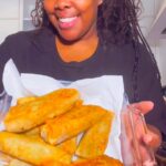 Amber Riley Instagram - Getting on my man’s nerves one plate at a time! I love you babe @scoobzdoo 😂 I’m definitely making this a series now! My mother actually taught me to make egg rolls, then my friend’s mom showed me how her culture makes them forreal. Mrs. Masuda taught me to make spring rolls. She married a Japanese man (hence the last name being Masuda) but she is actually Chinese! I really enjoy all Asian food, and it was a really cool experience making them with her. Of course, I put my little spin on it and made the Chinese-american version of the egg roll. Sometimes it’s really an experiment and I don’t know wth I’m doing 😂! In no way am I a chef, but figuring it out is the best part of the creative process! I just love to have fun! I hope you enjoy these videos and much as I enjoy making them then eating the food! Shout out to the always hungry @coreymekell in the video, one of my BFFs and he greedy as HELL 😂Love y’all 🫶🏾