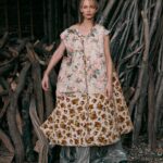 Amber Valletta Instagram - “I turn 50 this February, meaning I’ve worked in fashion for 35 years, and I’ve been a sustainability advocate for more than 20 of those, but in 2023 I hit a wall, mentally and physically,” confesses @AmberValletta. “The news just felt relentlessly bad – environmental and otherwise. I knew that, if I was ever going to get back on my feet, I needed to find a more sustainable approach to sustainability work.” In the January 2024 issue of #BritishVogue, the model and climate advocate reveals her path towards a more conscious future – and how fashion is following her. Click the link in bio to read the interview and see the full story in the new issue, on newsstands Tuesday 19 December. #AmberValletta photographed by @CharlotteMWales and styled by @PoppyKain, with hair by #ShingoShibata, make-up by #KanakoTakase, nails by @TrishLomax, set design by @MaxBellhouse, movement director by @EricVonChristison and production by @FaragoProjects. [Image one shows Amber Valletta, a white woman, from the knees up, sitting in front of a haystack in what appears to be a barn. She looks directly at the camera, her blonde hair loosely tied up, and wears a white mid-length dress underneath a white cape with a white scarf tied around her neck. A large gold pendant, roughly the shape of a horseshoe, hangs at her sternum on a leather chain. Image two shows a full-length portrait of Amber Valletta, a white woman, in a clearing, a forest visible in the background behind her, looking directly at the camera. She is standing with her legs slightly splayed and wears a wide-brimmed dark brown hat, a ribbon tied around its crown. She has a pair of khaki trousers on, while a light pink collared shirt peeks out of the top of her brown trench coat, whose belt is tied insouciantly at her waist. Image three shows a full-length portrait of Amber Valletta, a white woman, standing in front of a pile of kindling and firewood. She wears a quilted floral sleeveless coat liner with an oversized zip over a silver metallic gown. The wind is blowing locks of her shoulder-length blonde hair across her face, and her right arm rests casually on a piece of wood.]