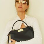 Amber Valletta Instagram - I see you 💛#FendiPeekaboo 🌟🌟 @silviaventurinifendi @mrkimjones