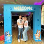 Amy Hart Instagram - This Episode Of Bluey Is Called Stanley’s First Birthday 🎂 💙🩵 The best time for my little boys first birthday 🎁 Theme:I looked on Pinterest and sent @everylastdetail_x a reeeally long voice note and as always they delivered!!! Even down to themed waters, biscuits from @thecupcakecollectionx , dog bowls instead of plates and little bone name tags 🥲. Roll on my UK hen do!! Food: I got pizzas for the adults, lots of different cans of drink and my Nan brought some cupcakes 🤣 For the babies I just went online and ordered so so many @kiddyliciousuk snacks. Felt this was the best zero waste option as now our cupboard is stocked with the ones we didn’t use!! My mum also did a tray of sandwiches and a tray of chicken dippers and sausages. Activities: We used two local family run companies, @rentyoureventsussex for the bluey soft play and DSH Leisure for the bouncy castle. I had DSH castles my whole childhood so really special that we can now use them for Stanley!! We also had @one_stop_partyshop come along with Bluey herself! I tried to book the full 2 hour party but they recommended that we just did 30 mins and it was fab! Games, singing and dancing and a meet and greet! I also used to do panto with Blueys party assistant so it really was the most Worthing party you can get 🤣 Cake: We used @kellyscakes_ We had white chocolate and raspberry (Stanley’s faves) and it was sooo good! Also very reasonably priced and I finally managed to order a cake for the size of the guest list and not for the feeding of the 5000!! Outfit: @indielledesigns 💙 my go to for seasonal clothing! Party Boxes: I had seen adopt a floppy on Pinterest so asked @my1styears if we could do a bulk order of the bunnies, they took it extra and gifted everyone a personalised denim jacket 😢 I also bought a box of bubble wands off Amazon and each child got a little book too! (Little libraries, also from Amazon!) (m1y also gave me a discount code which is AMYHART10 xx)