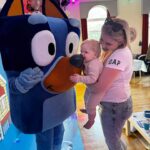 Amy Hart Instagram - This Episode Of Bluey Is Called Stanley’s First Birthday 🎂 💙🩵 The best time for my little boys first birthday 🎁 Theme:I looked on Pinterest and sent @everylastdetail_x a reeeally long voice note and as always they delivered!!! Even down to themed waters, biscuits from @thecupcakecollectionx , dog bowls instead of plates and little bone name tags 🥲. Roll on my UK hen do!! Food: I got pizzas for the adults, lots of different cans of drink and my Nan brought some cupcakes 🤣 For the babies I just went online and ordered so so many @kiddyliciousuk snacks. Felt this was the best zero waste option as now our cupboard is stocked with the ones we didn’t use!! My mum also did a tray of sandwiches and a tray of chicken dippers and sausages. Activities: We used two local family run companies, @rentyoureventsussex for the bluey soft play and DSH Leisure for the bouncy castle. I had DSH castles my whole childhood so really special that we can now use them for Stanley!! We also had @one_stop_partyshop come along with Bluey herself! I tried to book the full 2 hour party but they recommended that we just did 30 mins and it was fab! Games, singing and dancing and a meet and greet! I also used to do panto with Blueys party assistant so it really was the most Worthing party you can get 🤣 Cake: We used @kellyscakes_ We had white chocolate and raspberry (Stanley’s faves) and it was sooo good! Also very reasonably priced and I finally managed to order a cake for the size of the guest list and not for the feeding of the 5000!! Outfit: @indielledesigns 💙 my go to for seasonal clothing! Party Boxes: I had seen adopt a floppy on Pinterest so asked @my1styears if we could do a bulk order of the bunnies, they took it extra and gifted everyone a personalised denim jacket 😢 I also bought a box of bubble wands off Amazon and each child got a little book too! (Little libraries, also from Amazon!) (m1y also gave me a discount code which is AMYHART10 xx)