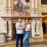 Amy Hart Instagram - Few more Family Snaps and how we got them! 🐭📸 1) On the grand staircase at Disneyland Hotel (lots of people still asking what the best way to book this is, all the info is in my massive trip report but we booked with @attractionticketsdotcom ). The level of customer service in this hotel is just mega!! There are so many cast members ready to help you. In the lobby there are people milling around in the uniform but with a top hat on…they know all the photo spots, all the angles AND the lovely lady who took this got a shiny sticker out of her pocket to get Stanley’s attention 🤣 they give them out to kids in the lobby! These T-shirts are @ukgap but we got them from @nextofficial ! Stanley’s tracksuit is from @georgeatasda 2) This big throne is on the 2nd floor of the Disneyland Hotel in the corridor that goes towards the gift shop and the restaurants! 3) now, I messed up with this one a bit 🤣 everyone had said about going to the left of the castle, we got up early the day before and had pictures on a very quiet Main Street but thought I’d check it out for any lie in lovers, but I think I went too far left! This is still a nice photo (she says 🤣) but I think if you go to that little bridge behind me you get more of a front on view of the castle! It was like 5 degrees but my puffa just wasn’t looking fly 🤣 4) Whilst Sam was taking picture 2, again a cast member walked past and asked if we’d like a full family photo! I feel like Stanley looks like a proper kid in these 🤣 5) Again the lovely lady in the top hat suggested we got one in front of the fire place too! We love a helpful insta gal! Next time we go, what other iconic pics should we get?! #disney #disneyland #disneyworld #disneygram #disneylife #disneyprincess #waltdisneyworld #love #mickeymouse #marvel #starwars #disneyparks #frozen #disneyfan #disneylove #disneyplus #waltdisney #wdw #instadisney #disneylandparis #disneymagic #pixar #disneychannel #disneyaddict #toystory #disneyinsta #magickingdom #disneyphotography #disneylandhotel