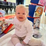 Amy Hart Instagram - This Episode Of Bluey Is Called Stanley’s First Birthday 🎂 💙🩵 The best time for my little boys first birthday 🎁 Theme:I looked on Pinterest and sent @everylastdetail_x a reeeally long voice note and as always they delivered!!! Even down to themed waters, biscuits from @thecupcakecollectionx , dog bowls instead of plates and little bone name tags 🥲. Roll on my UK hen do!! Food: I got pizzas for the adults, lots of different cans of drink and my Nan brought some cupcakes 🤣 For the babies I just went online and ordered so so many @kiddyliciousuk snacks. Felt this was the best zero waste option as now our cupboard is stocked with the ones we didn’t use!! My mum also did a tray of sandwiches and a tray of chicken dippers and sausages. Activities: We used two local family run companies, @rentyoureventsussex for the bluey soft play and DSH Leisure for the bouncy castle. I had DSH castles my whole childhood so really special that we can now use them for Stanley!! We also had @one_stop_partyshop come along with Bluey herself! I tried to book the full 2 hour party but they recommended that we just did 30 mins and it was fab! Games, singing and dancing and a meet and greet! I also used to do panto with Blueys party assistant so it really was the most Worthing party you can get 🤣 Cake: We used @kellyscakes_ We had white chocolate and raspberry (Stanley’s faves) and it was sooo good! Also very reasonably priced and I finally managed to order a cake for the size of the guest list and not for the feeding of the 5000!! Outfit: @indielledesigns 💙 my go to for seasonal clothing! Party Boxes: I had seen adopt a floppy on Pinterest so asked @my1styears if we could do a bulk order of the bunnies, they took it extra and gifted everyone a personalised denim jacket 😢 I also bought a box of bubble wands off Amazon and each child got a little book too! (Little libraries, also from Amazon!) (m1y also gave me a discount code which is AMYHART10 xx)