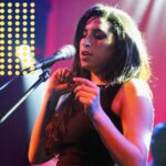 Amy Winehouse Instagram - Even just looking at photos of Amy performing nearly 20 years ago, we are reminded of her loving soul and how her legacy lives on today. 🤍 📸 Matt Cardy 2004 at Brixton Academy