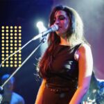 Amy Winehouse Instagram - Even just looking at photos of Amy performing nearly 20 years ago, we are reminded of her loving soul and how her legacy lives on today. 🤍 📸 Matt Cardy 2004 at Brixton Academy