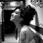 Amy Winehouse Instagram - "All the songs sound better when you're next to me" 🖤 📸 Jill Furmanovsky, 2006