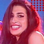 Amy Winehouse Instagram - Amy giving her signature jazz improv twist on the ending of “Stronger Than Me” in Italy, 2004, complete with a cheeky grin and dance moves.