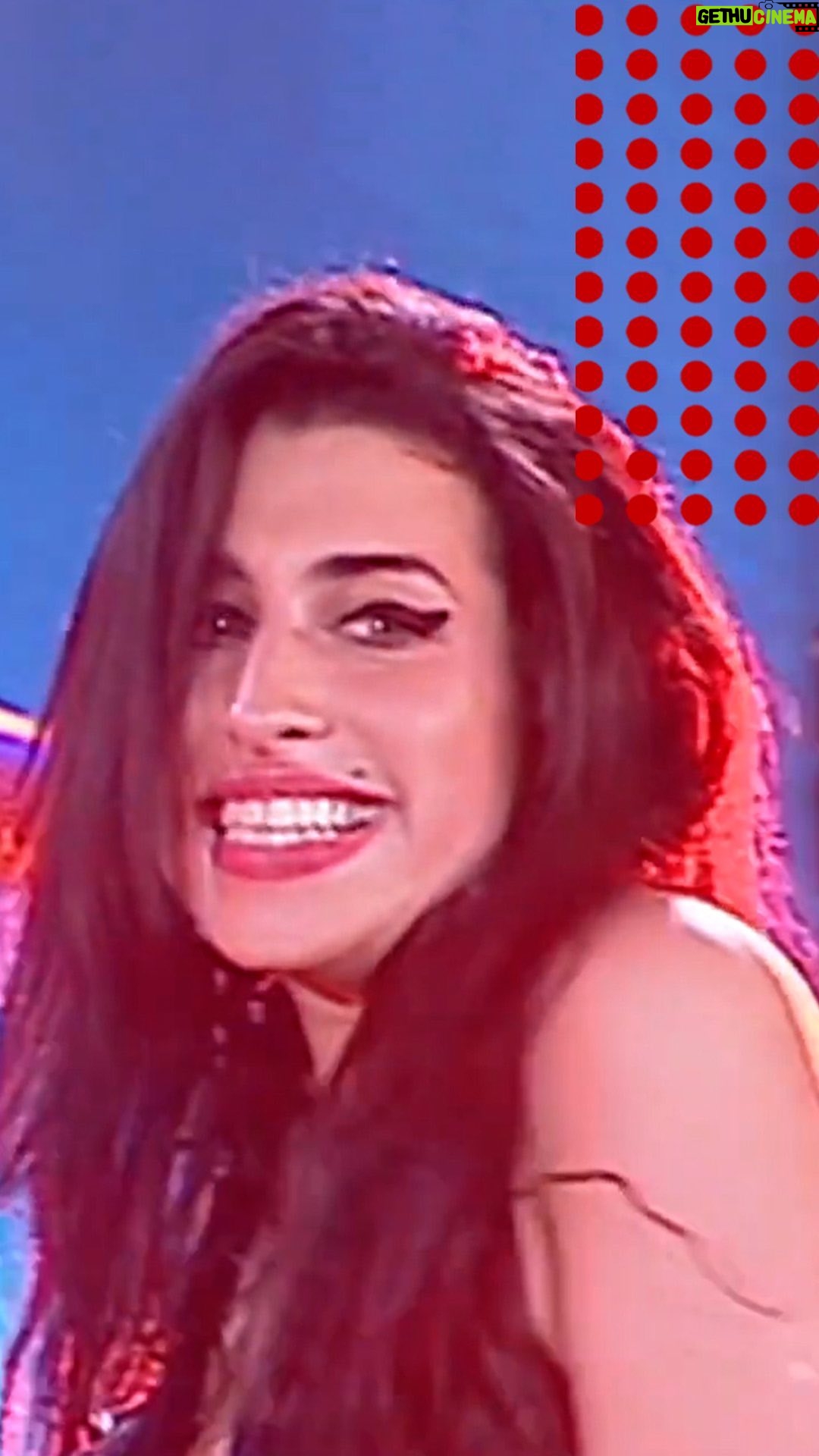 Amy Winehouse Instagram - Amy giving her signature jazz improv twist on the ending of “Stronger Than Me” in Italy, 2004, complete with a cheeky grin and dance moves.