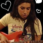 Amy Winehouse Instagram - Amy’s passion for guitars infused soulful depth into her music. At the age of 13, she received her first guitar, and a year later, she began writing her own music. Her bond with her guitar was as profound as her lyrics, shaping the timeless melodies we cherish today. Which songs by Amy can you perform on the guitar? 🎸 “And when I’m lonely, Cherry’s there. And she plays along while I sing out my blues” ❤️ #Frank20