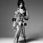 Amy Winehouse Instagram – Amy was photographed by @brookenipar in 2007, showcasing her unique style in a gorgeous zebra coat. 🖤