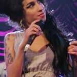 Amy Winehouse Instagram - Amy performing “Wake Up Alone” at Shepherd’s Bush Empire, for the DVD ‘I Told You I Was Trouble’ in 2007. We hold this show so dear in our hearts not just for how happy and beautiful Amy looked this night as she delivered this iconic set, but also for how lucky we are to have this pristine memory of her at her Back to Black best. 🖤 “As far as my heart, I’d rather be restless; the second I stop, the sleep catches up and I’m breathless.”