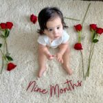 Anjelah Johnson-Reyes Instagram - My sweet angel baby. We can’t believe you’re 9 months old already! You’ve been on 13 flights. You are currently sleep training (again). You recognize your different family members on FaceTime by the things they do and say. You love your doggie brother Banzo. You gnaw on a chicken bone like a grown man and we love it! Happy 9 months #Rosieharlowreyes