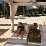 Anna Todd Instagram - mentally still here ☀️ physically: wondering why the helllll it’s raining in LA again when planning this trip, the main focus was wellness and mindfulness. i wanted quiet, soundbaths, yoga, meditation, and art. the place i stayed is designed for just that, so it was heaven. i wanted to share this thing i did (the pic with the rake) it’s called ephemeral art and its basically like a giant zen garden in the sand, but you spend nearly two hours creating this beautiful design under the hot sun, knowing that it’s going to be taken away by nature. it helps eliminate the idea of perfectionism, and helped me feel detachment and just live in the moment. it might sound silly, but temporary art was one of the highlights of my trip. i also saw sea turtles, snorkeled in a coral reef, had a lot of energy cleansing and ancient Mayan rituals, focused on the four elements. ive never experienced anything like this so i just wanted to share. i woke up every morning to watch the sunrise and it was beyond stunning ☀️ what are you doing today? do you have any plans? i will be catching up on work stuff, making some reels and TikTok’s of my trip, posting some stuff in the group chat 😉 and snuggling with Asher. he has his playgroup again today so wish us luck! i hope you have a great day ☀️🫶🏼 tell me all the things 🌴