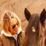 Arielle Kebbel Instagram - every where I go i talk about wild horses, the sickening politics behind round ups and the incredible work @skydogsanctuary does to help rescue wild horses and burros who’ve ended up in kill pens, are headed to slaughter, been abused, starved, or neglected. they also educate people about what’s happening to America’s wild horses and the implications of the Bureau of Land Management’s Adoption Incentive program. thank you @bedfordnewcanaanmag for your support and thank you @juliebettstestwuide for the most special photographs of me and snow. you capture precious moments and i cherish them. photographed at the beautiful Rounded Crest Farm where both @manhattanridingclub @galloping_guru are located ( fun fact, a quiet place was also filmed here ;) * #savewildhorses #wildhorserescue #mustang #wild #bedford #newcaanan #magazine #wildhorsephotography #stoptheroundups #snowwhite