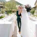 Arielle Vandenberg Instagram - I’ve always dreamed of having an intimate, backyard wedding! And two of our best friends, graciously offered their home! We wanted our wedding to be simple and sweet! And that’s exactly how it was! Bright and delicate flowers sprinkled across the tables. It definitely helped that the entire backyard had white roses in full bloom! (Gods gift saved us thousands of dollars lol). We had a deliciously unique cake that tasted of tres leches and apricot 🤤 (hands down favorite cake I’ve ever had). I’ve always wanted pizza at my wedding, so we hauled a 500 lbs pizza oven into the backyard for fresh amazing pizza! (Should have ate more that night, that’s for sure. 😂) Everyone took home Cutie cookies painted like our favorite girl, Stinky! Love was in the air as the fairy lights above our heads twinkled in the night sky and we danced the night away! ✨ Photos: @christinamcneill Video: @whiteinrevery Coordinator: @carlyraeweddings Dress: @chosenbykyha via @enblanc_la Veil: @amsale Glam: @afton Suit: @paulsmithdesign Catering: @madeinitalybistro Florals: @floretfloral Music: @rickyrocksdrums Cake: @kellygraycakes Cookies: @cubandcuppy Rentals: @lapinataparty Venue: @thejasonkennedy @thelaurenkennedy backyard 😍