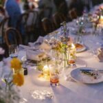 Arielle Vandenberg Instagram - I’ve always dreamed of having an intimate, backyard wedding! And two of our best friends, graciously offered their home! We wanted our wedding to be simple and sweet! And that’s exactly how it was! Bright and delicate flowers sprinkled across the tables. It definitely helped that the entire backyard had white roses in full bloom! (Gods gift saved us thousands of dollars lol). We had a deliciously unique cake that tasted of tres leches and apricot 🤤 (hands down favorite cake I’ve ever had). I’ve always wanted pizza at my wedding, so we hauled a 500 lbs pizza oven into the backyard for fresh amazing pizza! (Should have ate more that night, that’s for sure. 😂) Everyone took home Cutie cookies painted like our favorite girl, Stinky! Love was in the air as the fairy lights above our heads twinkled in the night sky and we danced the night away! ✨ Photos: @christinamcneill Video: @whiteinrevery Coordinator: @carlyraeweddings Dress: @chosenbykyha via @enblanc_la Veil: @amsale Glam: @afton Suit: @paulsmithdesign Catering: @madeinitalybistro Florals: @floretfloral Music: @rickyrocksdrums Cake: @kellygraycakes Cookies: @cubandcuppy Rentals: @lapinataparty Venue: @thejasonkennedy @thelaurenkennedy backyard 😍