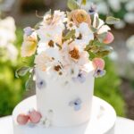 Arielle Vandenberg Instagram - I’ve always dreamed of having an intimate, backyard wedding! And two of our best friends, graciously offered their home! We wanted our wedding to be simple and sweet! And that’s exactly how it was! Bright and delicate flowers sprinkled across the tables. It definitely helped that the entire backyard had white roses in full bloom! (Gods gift saved us thousands of dollars lol). We had a deliciously unique cake that tasted of tres leches and apricot 🤤 (hands down favorite cake I’ve ever had). I’ve always wanted pizza at my wedding, so we hauled a 500 lbs pizza oven into the backyard for fresh amazing pizza! (Should have ate more that night, that’s for sure. 😂) Everyone took home Cutie cookies painted like our favorite girl, Stinky! Love was in the air as the fairy lights above our heads twinkled in the night sky and we danced the night away! ✨ Photos: @christinamcneill Video: @whiteinrevery Coordinator: @carlyraeweddings Dress: @chosenbykyha via @enblanc_la Veil: @amsale Glam: @afton Suit: @paulsmithdesign Catering: @madeinitalybistro Florals: @floretfloral Music: @rickyrocksdrums Cake: @kellygraycakes Cookies: @cubandcuppy Rentals: @lapinataparty Venue: @thejasonkennedy @thelaurenkennedy backyard 😍