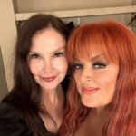 Ashley Judd Instagram – My big sister. My protector who powdered me when I was an infant, let me do her Civics homework when I was in 6th grade (which made me feel “big”), who taught me how to drive (it was a 1957 Chevy), with whom I compared mosquito bites  after we played in eastern Kentucky creeks looking for crawdads. Oh, yes — she happened to sing some, too. 

This past Friday, she sang in Knoxville, and it was glorious. My favorite songs are the ones our Mama wrote, so customized for her voice are they. Thank you to fans for loving my sister @wynonnajudd and helping to give her life purpose and meaning, and for recognizing that she’s indeed the G.O.A.T.